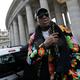 Illustration for article titled Why Is Dennis Rodman At The Vatican? He's Being Paid By A Betting Company, Of Course